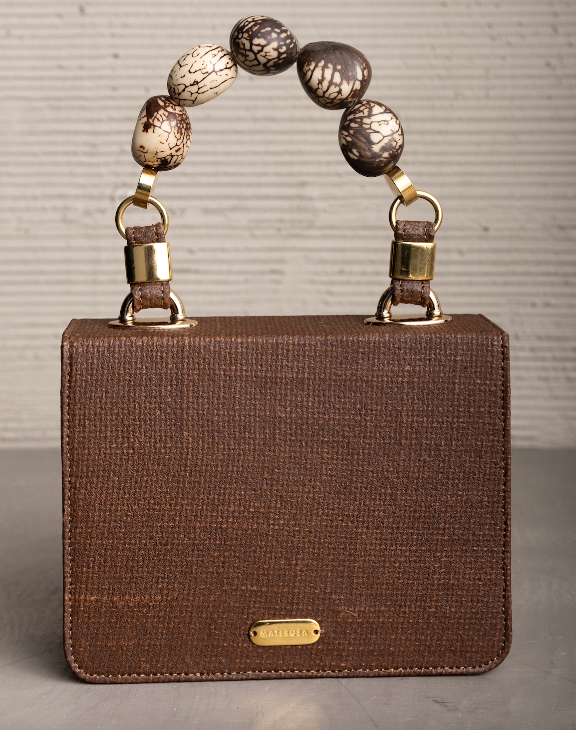 LOMARA PURSE WITH TAGUA SEEDS HANDLE
